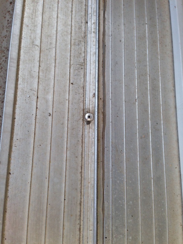 French door screen door track riveted in place