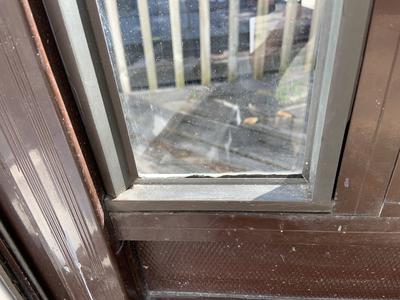 storm door glass holding by plastic beading