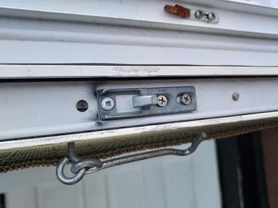 This hook sticks into the hole on the patio door