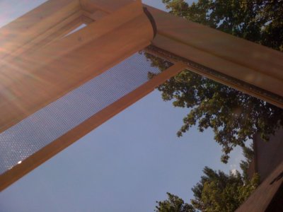 Storm door retractable